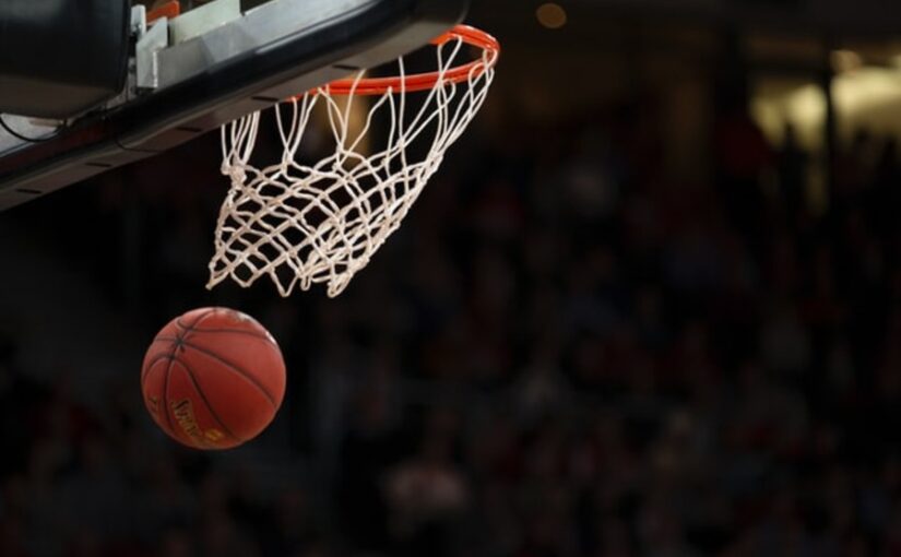 A basketball going through the rim